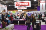 © ARMPL3272_06_VAP_SalonPharmagora2019.qcd-60-image_I3 - Le stand du Moniteur des pharmacies a été l’un des endroits les plus courus du salon. Son espace librairie a régalé une foule d’amateurs de livres.